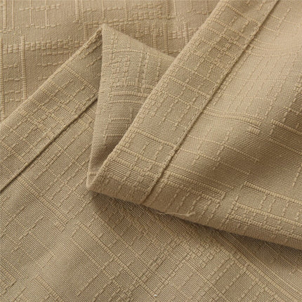 Beige geweven gordijn met ringen