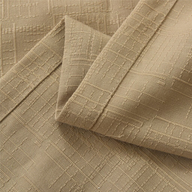 Beige geweven gordijn met ringen