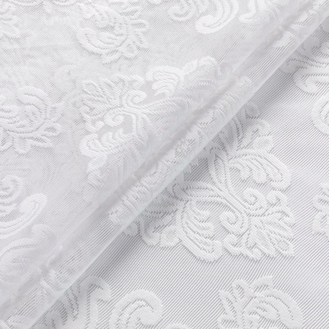 Witte vitrage met barok patroon