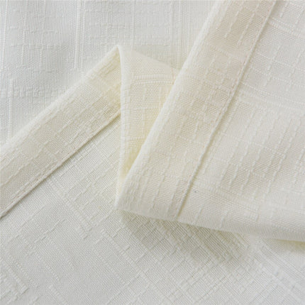 Beige geweven gordijn met ringen