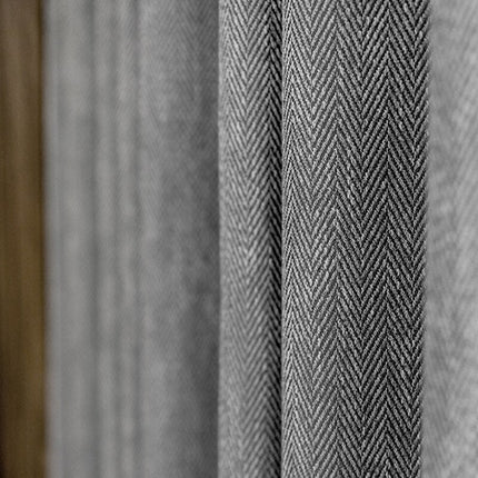 Donkergrijs verduisterend gordijn Valego visgraatmotief.