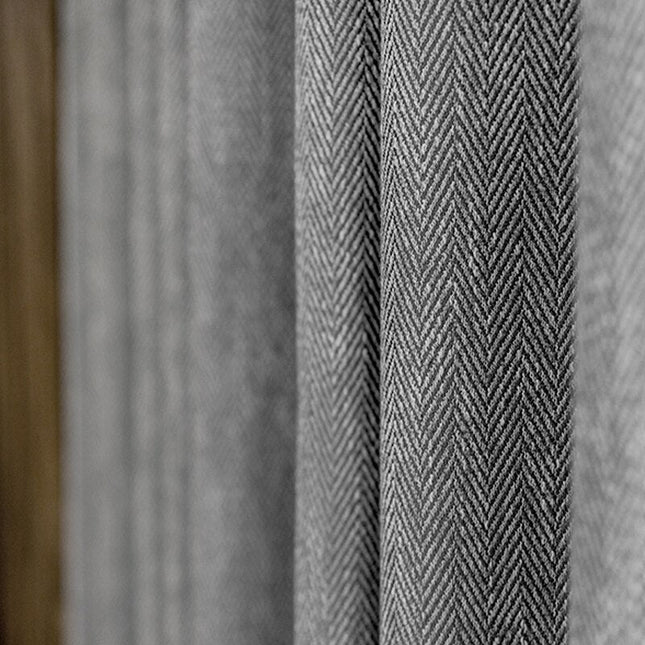 Donkergrijs verduisterend gordijn Valego visgraatmotief.