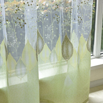 Vitrage gordijn met groene bladeren