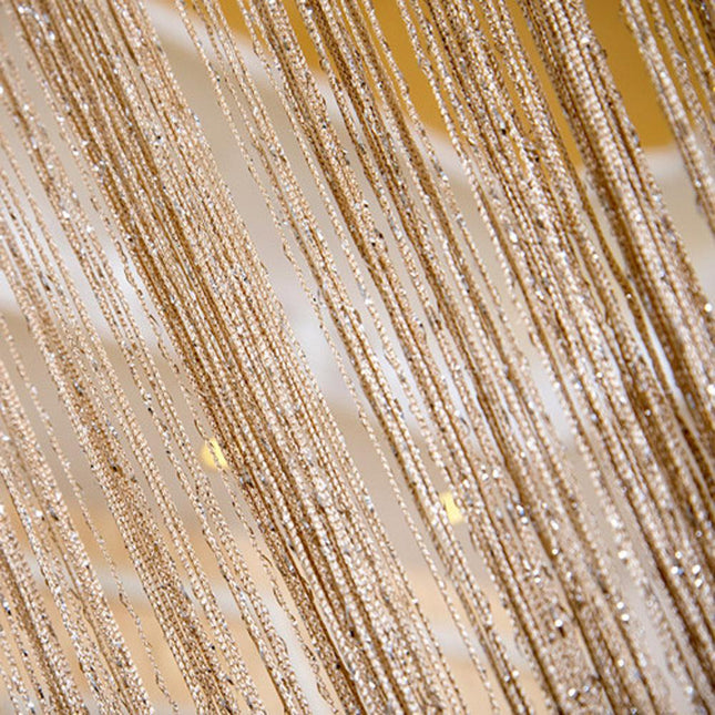 Goudkleurig draadjesgordijn met glitters