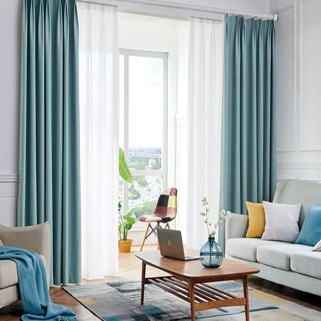 Blauw verduisterend gordijn Kross met linnenlook.